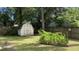 Backyard shed provides extra storage, complementing the landscaped yard at 109 Garbon Dr, Summerville, SC 29485