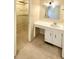 View of a bathroom with vanity and closet with shelving and neutral carpet at 109 Garbon Dr, Summerville, SC 29485