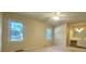 Bedroom with two windows, carpet, ceiling fan and en suite bathroom with vanity at 109 Garbon Dr, Summerville, SC 29485