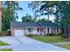 Charming single-story home features a brick facade, manicured lawn, and attached garage at 109 Garbon Dr, Summerville, SC 29485