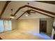 A spacious living room featuring vaulted ceilings, exposed beams, and multiple ceiling fans at 109 Garbon Dr, Summerville, SC 29485