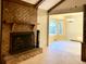 Charming living room with a brick fireplace leading into an adjoining dining area at 109 Garbon Dr, Summerville, SC 29485