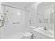 Bright white bathroom featuring a walk-in shower and convenient accessibility bars for added safety and assistance at 112 Roselle Ave, Goose Creek, SC 29445