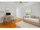 Bedroom featuring hardwood floors, a convertible sofa, and natural light at 112 Roselle Ave, Goose Creek, SC 29445