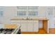Kitchen features stainless sink, wood countertop, and white cabinets at 112 Roselle Ave, Goose Creek, SC 29445