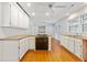 Updated kitchen with wood floors, stainless steel appliances, and white cabinetry at 112 Roselle Ave, Goose Creek, SC 29445