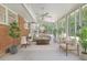 Bright sunroom featuring neutral furniture, lots of windows, and tile floors at 112 Roselle Ave, Goose Creek, SC 29445