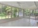 Bright sunroom with tile flooring and large windows offering serene outdoor views at 112 Roselle Ave, Goose Creek, SC 29445