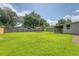 Aerial view of backyard featuring an outdoor gazebo, storage shed, and screened patio at 113 Jackson Rd, Ladson, SC 29456