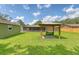 Backyard featuring a gazebo, a green storage shed, and the home's screened sunroom at 113 Jackson Rd, Ladson, SC 29456