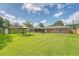 Spacious backyard featuring a gazebo, brick home, and green storage shed at 113 Jackson Rd, Ladson, SC 29456
