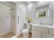 A bright bathroom with a tiled walk-in shower, a single sink vanity, and neutral colors at 113 Jackson Rd, Ladson, SC 29456