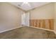 A carpeted bedroom features wainscotting, neutral paint, and an open door to the bathroom at 113 Jackson Rd, Ladson, SC 29456