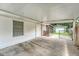 Spacious carport featuring a window and white door, providing ample covered parking at 113 Jackson Rd, Ladson, SC 29456