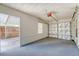 A one-car garage features an insulated garage door, pedestrian door, and a carpeted floor at 113 Jackson Rd, Ladson, SC 29456