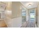 Home hallway view showcasing wood floors and white paneling at 113 Jackson Rd, Ladson, SC 29456