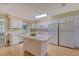 Bright kitchen features white appliances, a large island, and hardwood floors at 113 Jackson Rd, Ladson, SC 29456