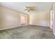 Cozy carpeted living room with unique ceiling fan, bright natural light, neutral walls at 113 Jackson Rd, Ladson, SC 29456