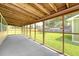 Spacious enclosed sunroom with a view of the expansive backyard and gazebo at 113 Jackson Rd, Ladson, SC 29456