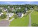 Charming neighborhood aerial view featuring well-manicured lawns and established trees on a sunny day at 1213 Grasswind Dr, Hanahan, SC 29410