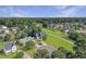 Beautiful aerial view of a neighborhood with lush green lawns and mature trees, under a clear blue sky at 1213 Grasswind Dr, Hanahan, SC 29410