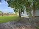 Spacious backyard featuring lush green lawn, privacy fence, and a charming gazebo at 1213 Grasswind Dr, Hanahan, SC 29410