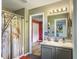 Bathroom featuring a single vanity, shower with curtain, and neutral color palette at 1213 Grasswind Dr, Hanahan, SC 29410