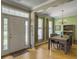 Open floor plan featuring a dining room with an elegant chandelier and hardwood floors at 1213 Grasswind Dr, Hanahan, SC 29410