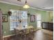 Inviting dining room with a large window and a classic table set, perfect for Gathering meals at 1213 Grasswind Dr, Hanahan, SC 29410