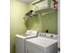 Efficient laundry room equipped with a washer and dryer, maximizing convenience at 1213 Grasswind Dr, Hanahan, SC 29410