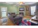 Comfortable living room with a fireplace, plush seating, and a TV for relaxation and entertainment at 1213 Grasswind Dr, Hanahan, SC 29410