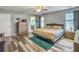 Relaxing main bedroom with a comfortable bed, dresser, and windows offering plenty of natural light at 1213 Grasswind Dr, Hanahan, SC 29410