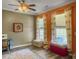 Cozy office space with natural light, custom drapes and a unique ceiling fan at 1213 Grasswind Dr, Hanahan, SC 29410