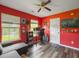 Well-lit office space with a ceiling fan, hardwood floors, and a convenient workspace at 1213 Grasswind Dr, Hanahan, SC 29410