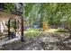Scenic backyard with a playground, storage shed, and workout equipment, perfect for entertainment and fitness at 124 Englewood Rd, Goose Creek, SC 29445