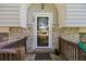 Charming front door entrance with brick accents and decorative details, creating a welcoming curb appeal at 124 Englewood Rd, Goose Creek, SC 29445