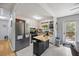 Bright kitchen featuring stainless steel appliances, light cabinets, and a functional kitchen island at 124 Englewood Rd, Goose Creek, SC 29445