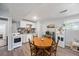 An efficient kitchen area featuring white appliances, backsplash, and a wooden dining table at 124 Englewood Rd, Goose Creek, SC 29445