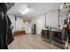 Well-organized laundry room with washer, dryer, storage, and convenient access at 124 Englewood Rd, Goose Creek, SC 29445