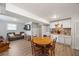 Open living space with a combined kitchen and living room, offering versatility and wood laminate flooring at 124 Englewood Rd, Goose Creek, SC 29445