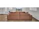 Comfortable living room showcasing a plush tan sectional sofa and entertainment center at 138 Sweet Cherry Ln, Summerville, SC 29486