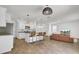 Open-concept living space with a kitchen island, a dining area, and a comfortable living room with a sofa at 138 Sweet Cherry Ln, Summerville, SC 29486