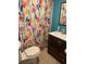 Colorful bathroom featuring a modern vanity and patterned shower curtain at 1969 Comstock Ave, North Charleston, SC 29405