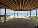 Beach view framed by an unfinished room with exposed beams in a house under construction at 2879 Marshall Blvd, Sullivans Island, SC 29482