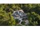 Charming home nestled amongst lush trees, featuring a screened in porch at 2911 Old Tavern Ct, Mount Pleasant, SC 29466