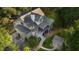 Stunning aerial view of home surrounded by lush trees and a screened-in porch at 2911 Old Tavern Ct, Mount Pleasant, SC 29466