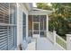 Back porch with wood floors, a white railing and a seating area at 2911 Old Tavern Ct, Mount Pleasant, SC 29466