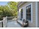 Covered back porch with wood floors, a seating area, and a white railing at 2911 Old Tavern Ct, Mount Pleasant, SC 29466