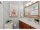 Bathroom with classic vanity, decorative mirror, and a coastal-themed painting adding charm at 2911 Old Tavern Ct, Mount Pleasant, SC 29466