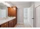 Spacious bathroom with double vanity, tile floors, and an open doorway to another room at 2911 Old Tavern Ct, Mount Pleasant, SC 29466